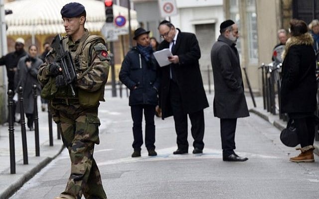 A French soldier patrols in the Jewish quarter of the Marais district, Paris, January 12, 2015. photo credit: AFP/Bertrand Guay) A French soldier patrols in the Jewish quarter of the Marais district, Paris, January 12, 2015. photo credit: AFP/Bertrand Guay)