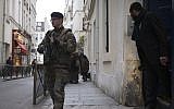 A French soldier patrols on January 12, 2015 near a Jewish school in Paris (photo credit: AFP/JOEL SAGET)