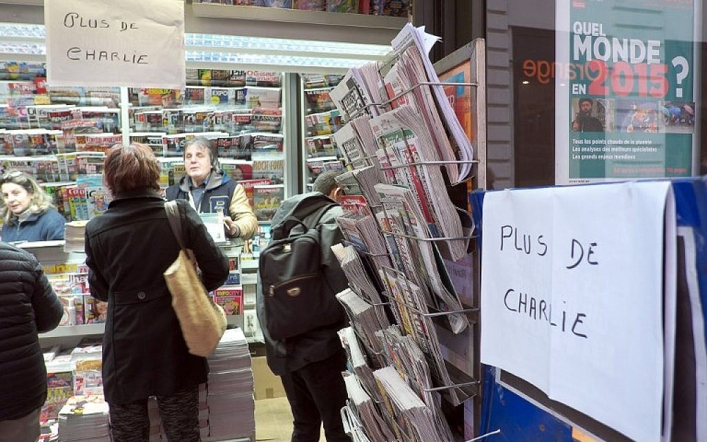 A sign which translates as "Charlie Hebdo - Sold Out" is displayed at a newsagents kiosk in Marseille on January 14, 2015 shortly after the latest edition of the French satirical weekly went on sale. (photo credit: AFP PHOTO / BORIS HORVAT) A sign which translates as "Charlie Hebdo - Sold Out" is displayed at a newsagents kiosk in Marseille on January 14, 2015 shortly after the latest edition of the French satirical weekly went on sale. (photo credit: AFP PHOTO / BORIS HORVAT)