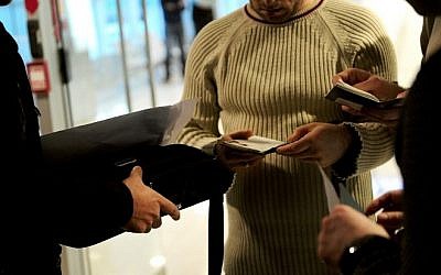 Plainclothes Turkish police officers check passengers' passports after a plane landed at the international airport in Istanbul on January 29, 2015. (Photo credit: AFP / OZAN KOSE) Plainclothes Turkish police officers check passengers' passports after a plane landed at the international airport in Istanbul on January 29, 2015. (Photo credit: AFP / OZAN KOSE)
