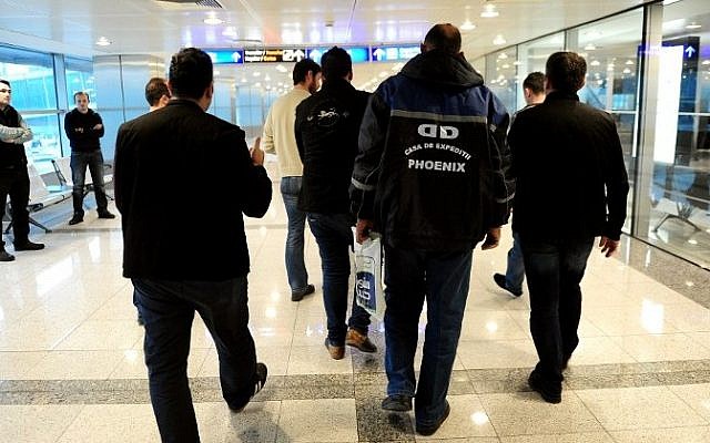Plainclothes Turkish police officers detain passengers after a plane landed at the international airport in Istanbul on January 29, 2015. (Photo credit: AFP/OZAN KOSE) Plainclothes Turkish police officers detain passengers after a plane landed at the international airport in Istanbul on January 29, 2015. (Photo credit: AFP/OZAN KOSE)