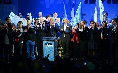 Kulanu party leader Moshe Kahlon surrounded by the party's Knesset candidates at a campaign kickoff event in Givat Brenner, January 15, 2015 (photo credit: courtesy/Facebook)