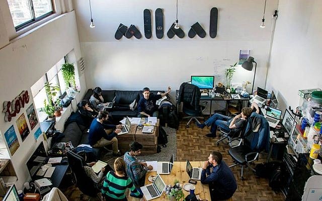The JSwipe team at work in their Williamsburg, Brooklyn headquarters. (Courtesy)
