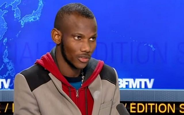 Lassana Bathily appearing on French television news channel BFMTV in the days after the attack on the Hyper Cacher supermarket in Paris on January 9, 2015. (Screenshot from YouTube) Lassana Bathily appearing on French television news channel BFMTV in the days after the attack on the Hyper Cacher supermarket in Paris on January 9, 2015. (Screenshot from YouTube)