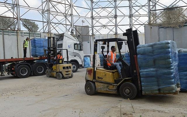 Goods and medical supplies being transferred to the Gaza Strip through the Kerem Shalom Crossing, July 19, 2014. (IDF Spokesperson's Unit) Goods and medical supplies being transferred to the Gaza Strip through the Kerem Shalom Crossing, July 19, 2014. (IDF Spokesperson's Unit)