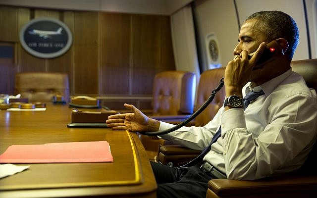 Barack Obama speaking to Francois Holland from aboard Air Force One on January 7, 2015. (photo credit: Pete Souza/White House)