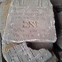 Jewish gravestones piled in a heap at the Brest Fortress in Belarus. (photo credit: Ilan Ben Zion/Times of Israel staff)