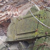 The tombstone of Rabbi Haim Leib Barit atop a pile of gravestones at the Brest Fortress in Belarus. (photo credit: Ilan Ben Zion/Times of Israel staff)