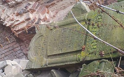 The tombstone of Rabbi Haim Leib Barit atop a pile of gravestones at the Brest Fortress in Belarus. (photo credit: Ilan Ben Zion/Times of Israel staff)