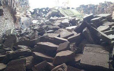 Jewish gravestones piled in a heap at the Brest Fortress in Belarus. (photo credit: Ilan Ben Zion/Times of Israel staff)