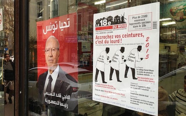 The entrance to the kosher restaurant Chez Guichi features a poster of newly elected Tunisian President Beji Caid Essebsi, reading long live Tunisia photo credit: Elhanan Miller/Times of Israel
