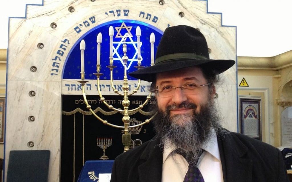 Rabbi Mevorah Zerbib stands near the ark of the Kedouchat Levy Synagogue in northern Paris, January 12, 2015. (photo credit: Elhanan Miller/Times of Israel) Rabbi Mevorah Zerbib stands near the ark of the Kedouchat Levy Synagogue in northern Paris, January 12, 2015. (photo credit: Elhanan Miller/Times of Israel)