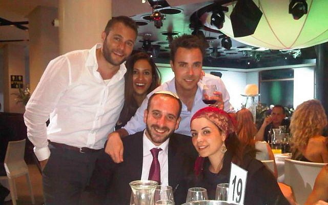 Rabbi Shlomo Chayan (bottom center, in tie) at an Aish Tel Aviv Shabbat dinner. (photo credit: Aish Tel Aviv Facebook)