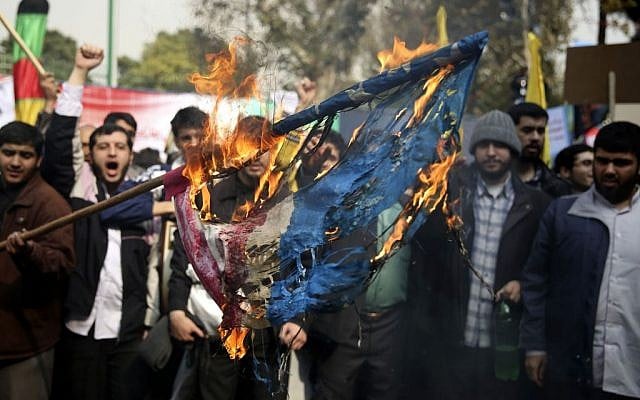 Iranian protesters burn an American flag during an annual anti-American rally in Tehran, Iran, Monday, Nov. 4, 2013 (photo credit: AP/Ebrahim Noroozi)