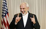 Iranian Foreign Minister Mohammad Javad Zarif laughs with reporters before meeting with US Secretary of State John Kerry in Geneva, Switzerland, Wednesday, Jan. 14, 2015 (photo credit: AP/Rick Wilking)