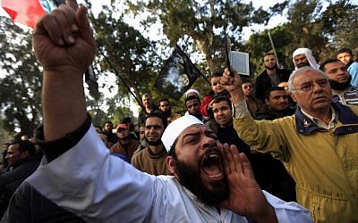 An Egyptian man chants slogans as he attends a protest held by Muslim Salafi groups against the French military attack on Mali, in front of the French embassy in Cairo, Egypt, Friday, Jan. 18, 2013 (photo credit: AP/Khalil Hamra)