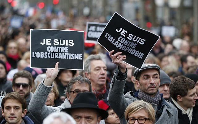 Demonstrators hold posters reading "I am against obscurantisme", left, and "I am against Islamophobia" during a march in Paris, France, Sunday, Jan. 11, 2015 photo cedit: AP/Michel Euler Demonstrators hold posters reading "I am against obscurantisme", left, and "I am against Islamophobia" during a march in Paris, France, Sunday, Jan. 11, 2015 photo cedit: AP/Michel Euler