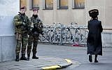 Belgian para-commandos patrol near a synagogue in the center of Antwerp, Belgium, on Saturday, Jan. 17, 2015. (photo credit: AP/Virginia Mayo)