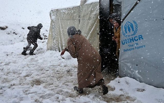 Syrians throw snow at each other at a refugee camp in Deir Zannoun village, in the Bekaa valley, east Lebanon, Wednesday, Jan. 7, 2015. (Photo credit: AP/Hussein Malla) Syrians throw snow at each other at a refugee camp in Deir Zannoun village, in the Bekaa valley, east Lebanon, Wednesday, Jan. 7, 2015. (Photo credit: AP/Hussein Malla)