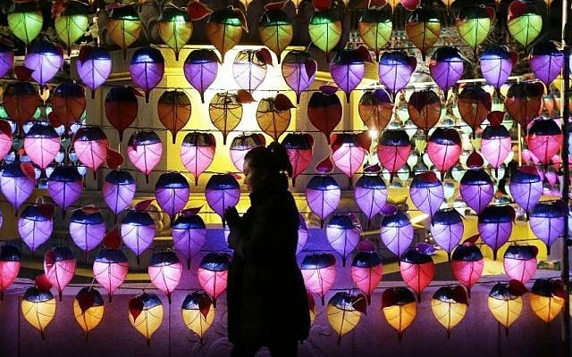 A woman prays during New Year celebrations at Jogye Buddhist temple in Seoul, South Korea, Thursday, Jan. 1, 2015. (Photo credit:AP/Ahn Young-joon)