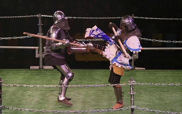 An Israeli "knight" kicks his opponent at the World Medieval Fighting Championship at Rishon LeZion, January 22, 2015. (Photo credit: Ariel Shrooster)
