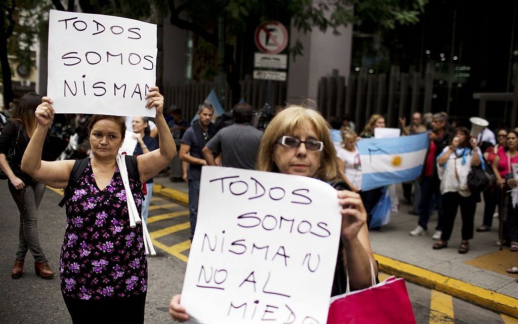 Women protest while holding signs that read in Spanish 'We are all Nisman, No to Fear,' referring to the death of special prosecutor Alberto Nisman, outside Congress in Buenos Aires, Argentina, Monday, Jan. 19, 2015. (photo credit: AP Photo/Rodrigo Abd) Women protest while holding signs that read in Spanish 'We are all Nisman, No to Fear,' referring to the death of special prosecutor Alberto Nisman, outside Congress in Buenos Aires, Argentina, Monday, Jan. 19, 2015. (photo credit: AP Photo/Rodrigo Abd)
