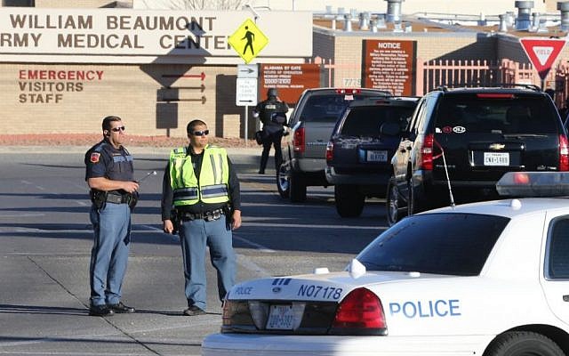Police officers guard an entrance to the Beaumont Army Medical Center/El Paso VA campus during the search for a gunman Tuesday, Jan. 6, 2014. (Photo credit: AP/The El Paso Times, Victor Calzada) Police officers guard an entrance to the Beaumont Army Medical Center/El Paso VA campus during the search for a gunman Tuesday, Jan. 6, 2014. (Photo credit: AP/The El Paso Times, Victor Calzada)