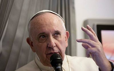 Pope Francis talks with reporters during his flight from Sri Lanka to Manila, Philippines, January 15, 2015. (photo credit: AP/Alessandra Tarantino, Pool)