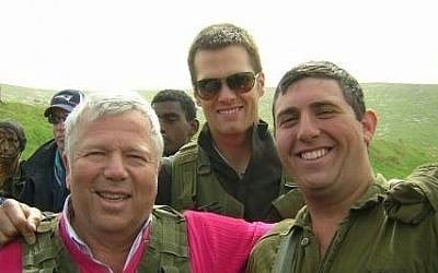 FILE: New England Patriots owner Robert Kraft and quarterback Tom Brady visit Nahal Haredi soldier Avi Sandler on his base during a 2006 trip to Israel (photo credit: Courtesy) FILE: New England Patriots owner Robert Kraft and quarterback Tom Brady visit Nahal Haredi soldier Avi Sandler on his base during a 2006 trip to Israel (photo credit: Courtesy)