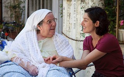Illustrative: a chaplain and one of her patients at Jerusalem's St. Louis Hospital (Photo credit: Yitz Woolf)
