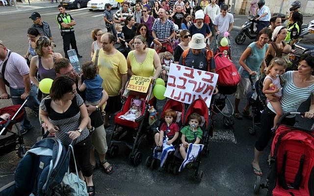 Israeli parents push strollers on a street in Jerusalem during a protest against the high cost of raising children in Israel, July 31, 2010. (Photo by Kobi Gideon / Flash90)