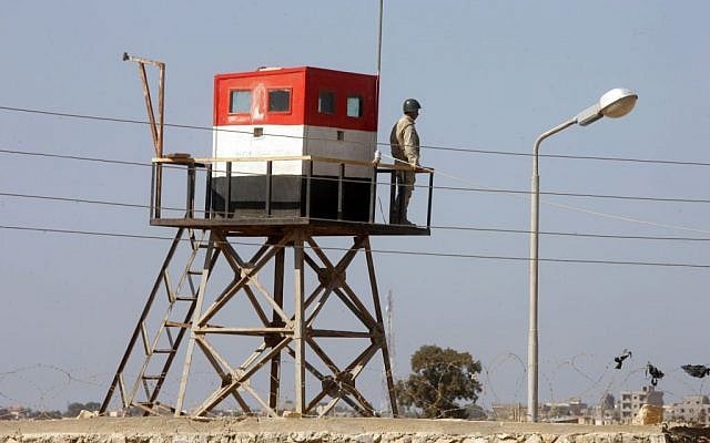 A picture taken from the Palestinian side of the Rafah border crossing in the southern Gaza Strip shows an Egyptian soldier manning a watch tower on the Egyptian side, on October 26, 2014. (photo credit: Abed Rahim Khatib/Flash90) A picture taken from the Palestinian side of the Rafah border crossing in the southern Gaza Strip shows an Egyptian soldier manning a watch tower on the Egyptian side, on October 26, 2014. (photo credit: Abed Rahim Khatib/Flash90)