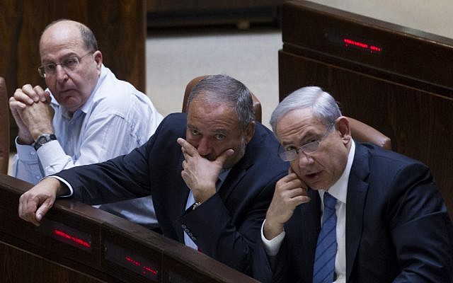 Prime Minister Benjamin Netanyahu (right), Foreign Minister Avigdor Liberman (center) and Defense Minister Moshe Ya'alon at the Knesset on November 12, 2014. (photo credit: Miriam Alster/FLASH90) Prime Minister Benjamin Netanyahu (right), Foreign Minister Avigdor Liberman (center) and Defense Minister Moshe Ya'alon at the Knesset on November 12, 2014. (photo credit: Miriam Alster/FLASH90)