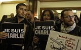People hold signs that read 'Je suis Charlie' ('I am Charlie' at a solidarity rally at the French ambassador's residence in Jaffa, Israel, on January 8, 2015. (photo credit: Amir Levy/Flash90)