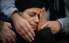 A mourner at the Jerusalem funeral for four Jewish victims of the Paris terror attacks, on January 13, 2015.  (photo credit: Ben Kelmer/Flash90)