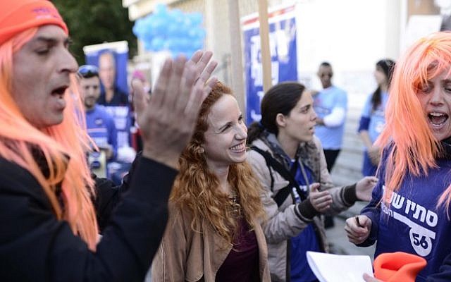 Labor's Stav Shafir with supporters wearing red wigs to promote her, during the Labor party primaries on January 13, 2015 (Photo credit: Tomer Neuberg/Flash90) 
