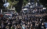 Thousands of people attend the funeral of the four Jewish victims in Jerusalem on January 13, 2015. (photo credit: Yonatan Sindel/Flash90)