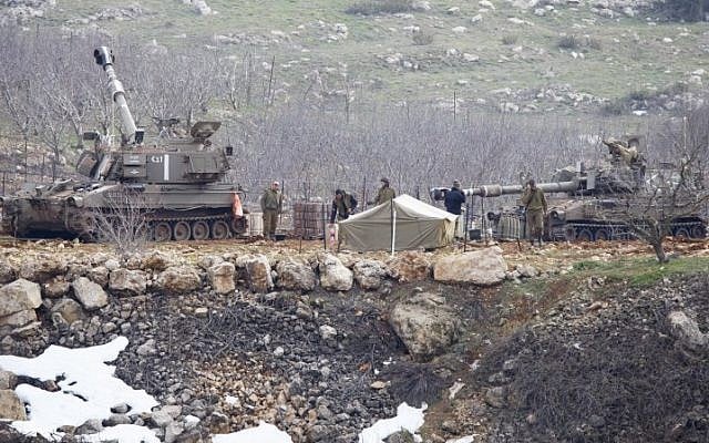 The IDF on high alert in the Golan Heights on Tuesday, January 27, 2015 after responding with artillery fire to two rocket attacks launched from Syrian territory. (Photo credit: Basal Awidat/Flash90) The IDF on high alert in the Golan Heights on Tuesday, January 27, 2015 after responding with artillery fire to two rocket attacks launched from Syrian territory. (Photo credit: Basal Awidat/Flash90)