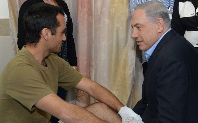 Prime Minister Benjamin Netanyahu visits wounded soldiers at Rambam hospital in Haifa, on January 30, 2015, following their injury in a January 28 Hezbollah attack in northern Israel near the Lebanese border. (Photo credit: Amos Ben Gershom/GPO) Prime Minister Benjamin Netanyahu visits wounded soldiers at Rambam hospital in Haifa, on January 30, 2015, following their injury in a January 28 Hezbollah attack in northern Israel near the Lebanese border. (Photo credit: Amos Ben Gershom/GPO)