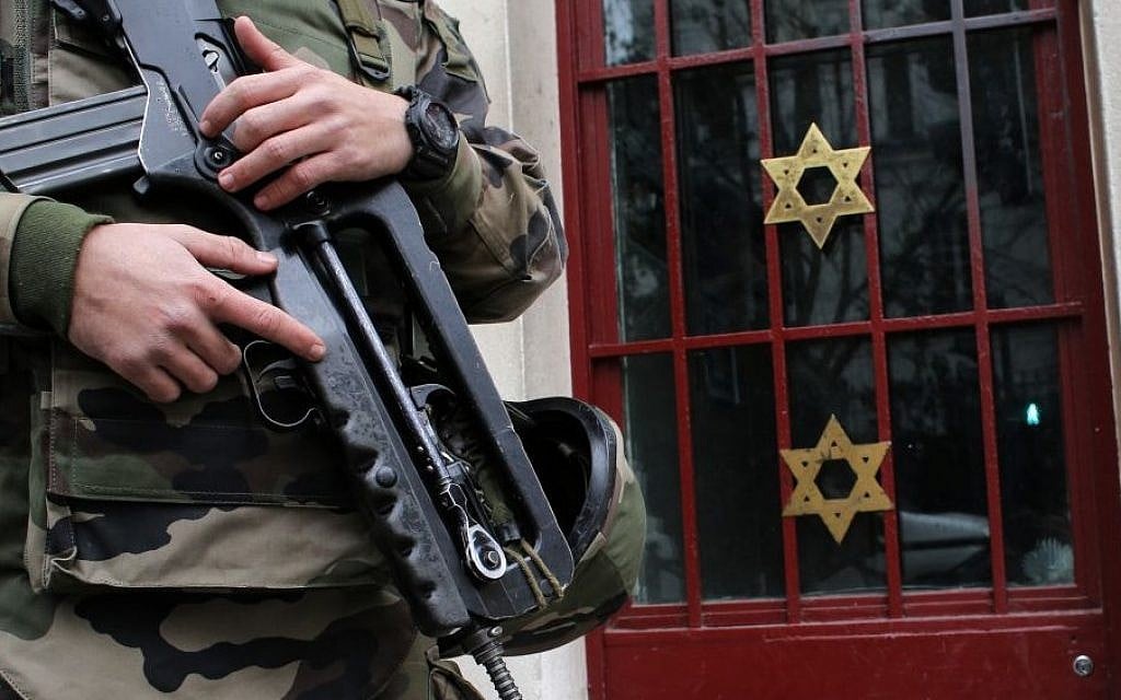 A soldier stands guard outside a synagogue in Neuilly-sur-Seine, outside Paris, France, January 13, 2015. (AP/Christophe Ena) A soldier stands guard outside a synagogue in Neuilly-sur-Seine, outside Paris, France, January 13, 2015. (AP/Christophe Ena)