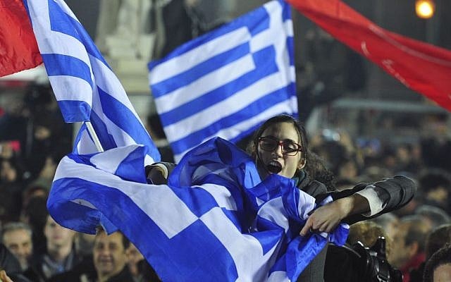 A woman waves a Greek flag during a speech by Alexis Tsipras, the leader of the newly elected Syriza party outside Athens University Headquarters, Jan. 25, 2015. (AP Photo/Fotis Plegas G.) A woman waves a Greek flag during a speech by Alexis Tsipras, the leader of the newly elected Syriza party outside Athens University Headquarters, Jan. 25, 2015. (AP Photo/Fotis Plegas G.)