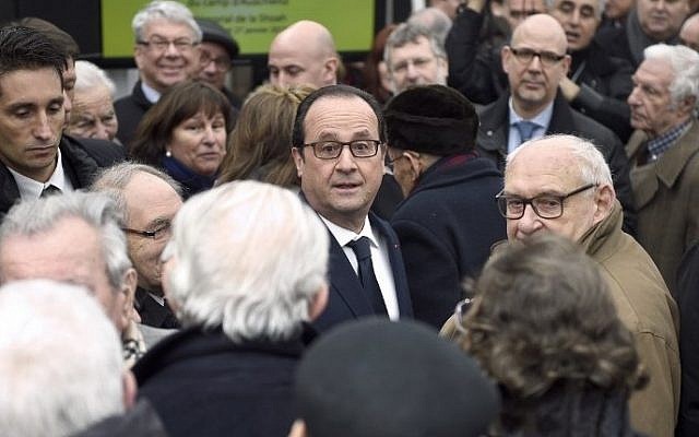 French President Francois Hollande (C) on January 27, 2015 in Paris, at the end of a ceremony at the Holocaust memorial in Paris to mark the international day of Holocaust remembrance, and the 70th anniversary of the liberation of the Auschwitz-Birkenau death camp, site of the largest single number of murders committed during World War II. (photo credit: AFP PHOTO / POOL / MARTIN BUREAU) French President Francois Hollande (C) on January 27, 2015 in Paris, at the end of a ceremony at the Holocaust memorial in Paris to mark the international day of Holocaust remembrance, and the 70th anniversary of the liberation of the Auschwitz-Birkenau death camp, site of the largest single number of murders committed during World War II. (photo credit: AFP PHOTO / POOL / MARTIN BUREAU)