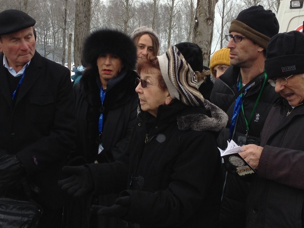 Israeli Holocaust survivor Batsheva Dagan (center), a former worker at the 'Canada' sorting center, describes the sonderkommando revolt on October 7, 1944. At far left is David Leichman, a witness to the revolt. (Amanda Borschel-Dan/The Times of Israel)