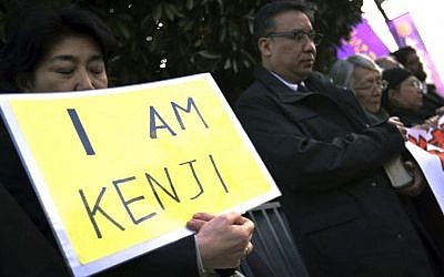 Protesters chant "Free Goto" during a demonstration in front of the Prime Minister's Official residence in Tokyo, Tuesday, Jan. 27, 2015. (Photo credit: AP/Eugene Hoshiko)
