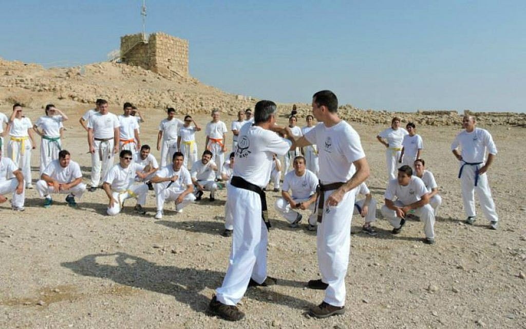 Kobi Lichtenstein (center left) leads a Krav Maga training session atop Masada, January 2015. (Courtesy) Kobi Lichtenstein (center left) leads a Krav Maga training session atop Masada, January 2015. (Courtesy)