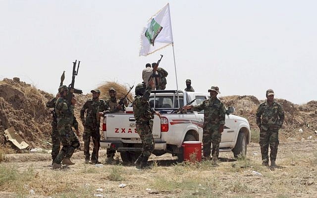 Iraqi forces and Shiite militiamen chant anti-terrorism slogans after breaking a siege on the farming town of Amirli, following US airstrikes against the Islamic State 105 miles north of Baghdad, Iraq on Aug. 31, 2014. (AP) Iraqi forces and Shiite militiamen chant anti-terrorism slogans after breaking a siege on the farming town of Amirli, following US airstrikes against the Islamic State 105 miles north of Baghdad, Iraq on Aug. 31, 2014. (AP)