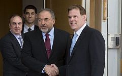 Israeli Foreign Minister Avigdor Lieberman, center left, shakes hands with his Canadian counterpart John Baird during their meeting in Jerusalem, Sunday, Jan. 18, 2015. (photo credit: AP Photo/Sebastian Scheiner)