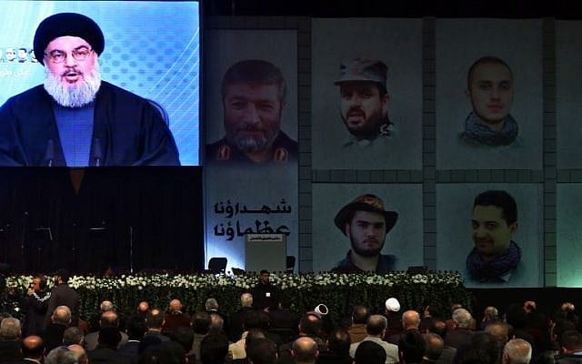 Hezbollah leader Sheikh Hassan Nasrallah speaks via video link to his supporters during a ceremony marking the death of six Hezbollah fighters and an Iranian general who were killed in an alleged Israeli airstrike in Syria’s Golan Heights last week, in the southern suburb of Beirut, Lebanon, Friday, Jan. 30, 2015. (photo credit: AP Photo/Bilal Hussein) Hezbollah leader Sheikh Hassan Nasrallah speaks via video link to his supporters during a ceremony marking the death of six Hezbollah fighters and an Iranian general who were killed in an alleged Israeli airstrike in Syria’s Golan Heights last week, in the southern suburb of Beirut, Lebanon, Friday, Jan. 30, 2015. (photo credit: AP Photo/Bilal Hussein)