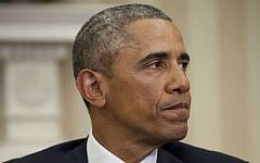 President Barack Obama pauses while speaking to members of the media, Wednesday, Jan. 7, 2015, in the Oval Office of the White House in Washington. Obama called the shootings at French newspaper a 'cowardly evil attack' on journalists and a free press. (photo credit: AP Photo/Pablo Martinez Monsivais)