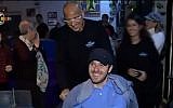 Ohad Ben Yishai pictured with his father, Shimon, at Ohad's 20th birthday celebration in Tel Aviv, November 25 2014 (screen capture: YouTube)